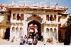 The carved arch entrance supported by grey white marble colums